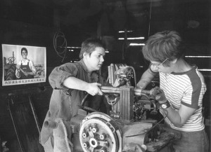 Gail Grassi and Kate Kaufman repairing a car. "It was a time when we all looked to the Chinese Revolution for progressive ideas of making the world a better place for people."
